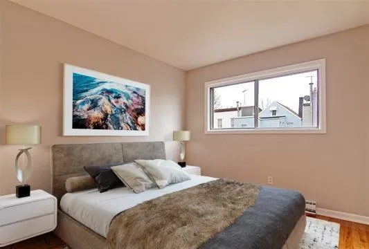 a bedroom with bed and a window