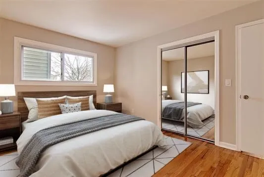 a bedroom with a bed and a window