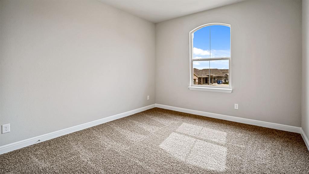 14517 Caelum Drive Haslet, TX 76052 - Photo 14 of 18 an empty room with a window