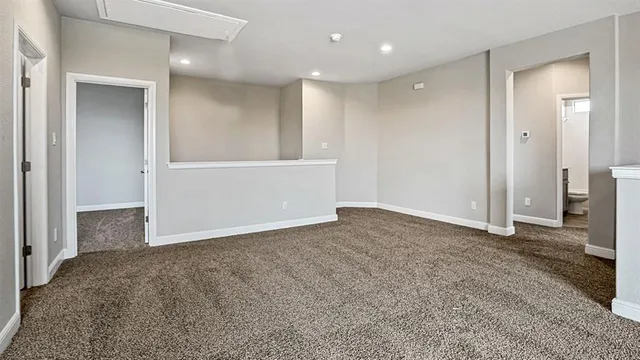 a view of an empty room and closet area