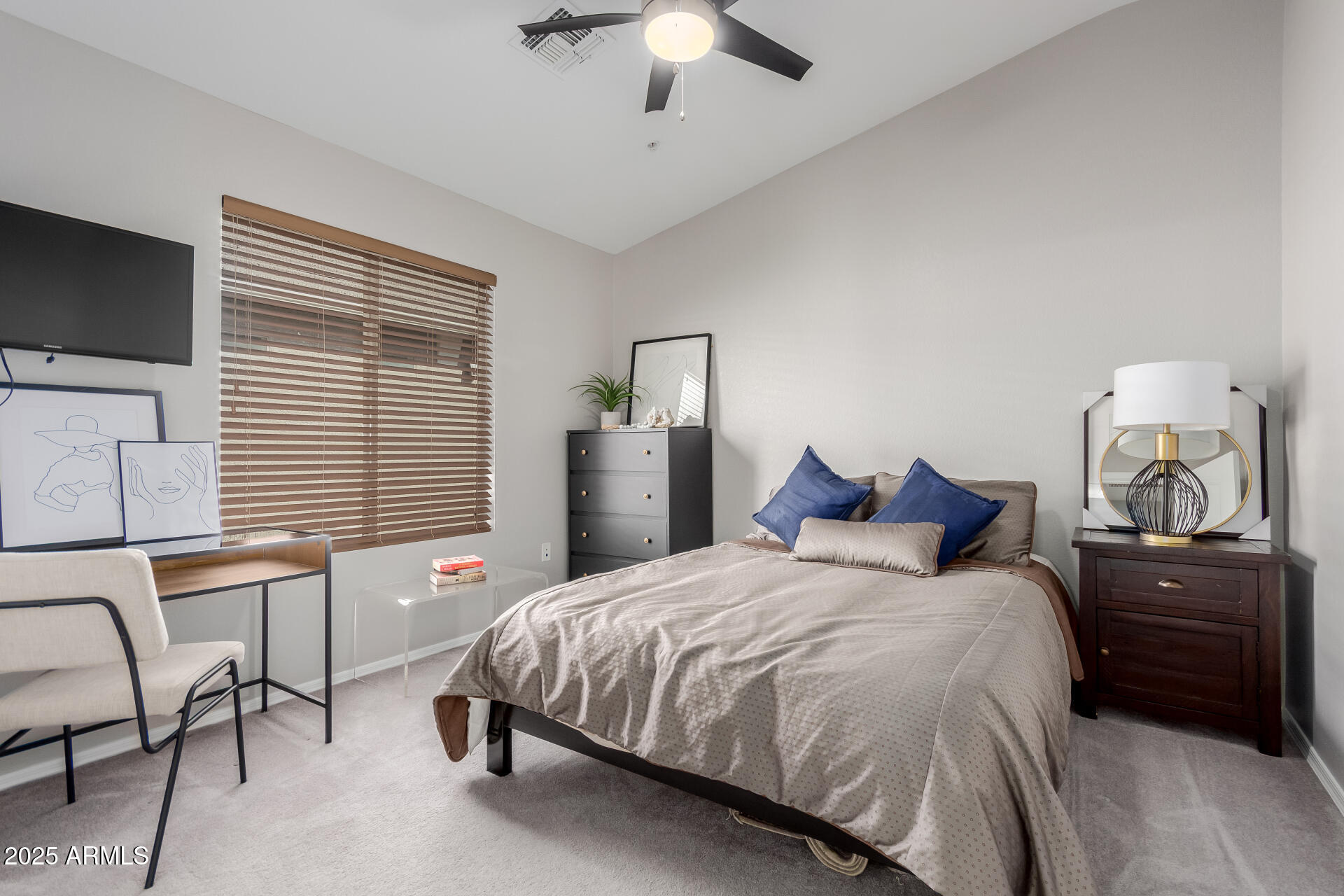 2401 East Rio Salado Parkway, Unit 1106 Tempe, AZ 85288 - Photo 18 of 40 a bedroom with a bed and a chandelier