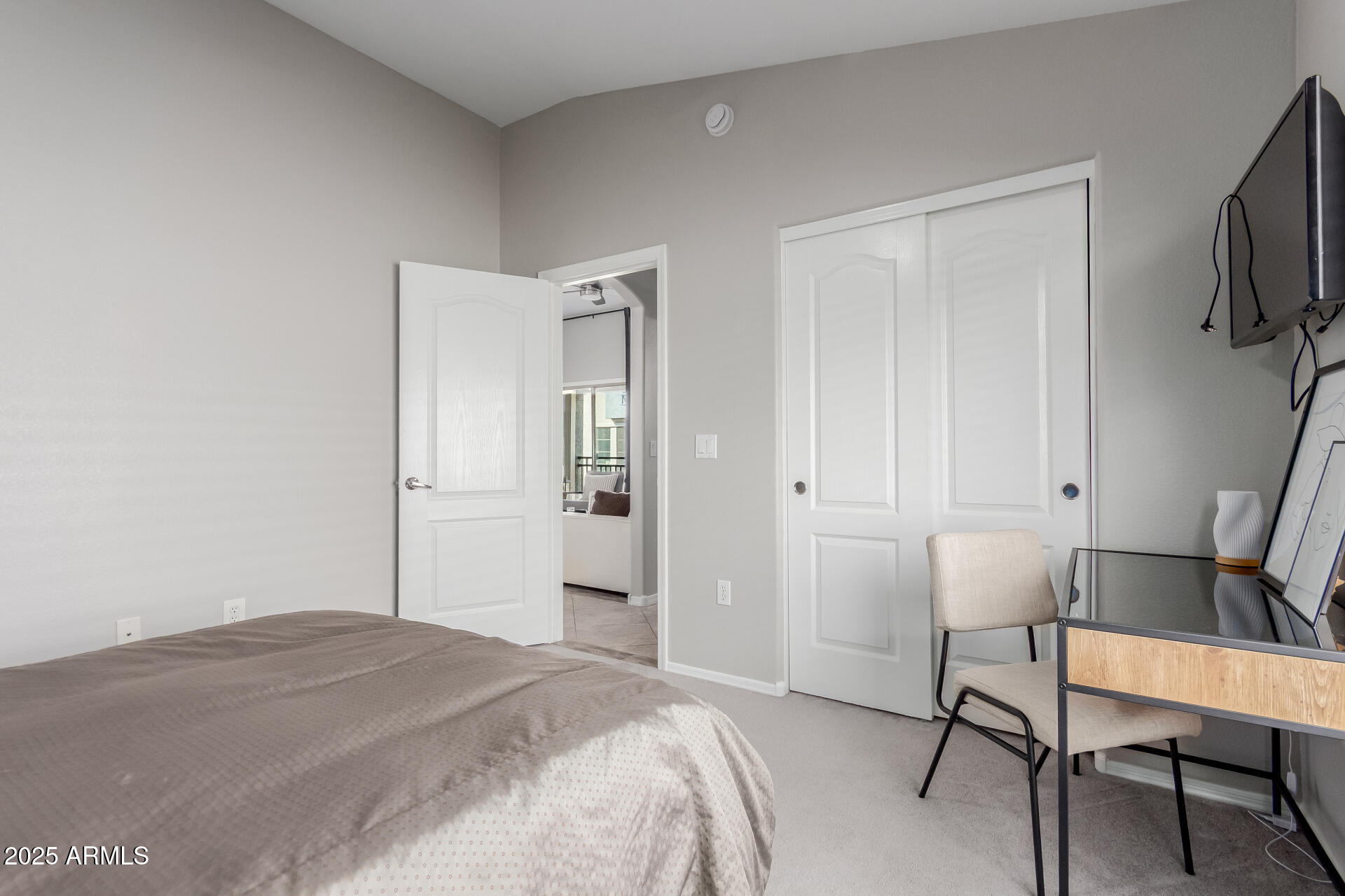 2401 East Rio Salado Parkway, Unit 1106 Tempe, AZ 85288 - Photo 19 of 40 a bedroom with a bed and a chair in it