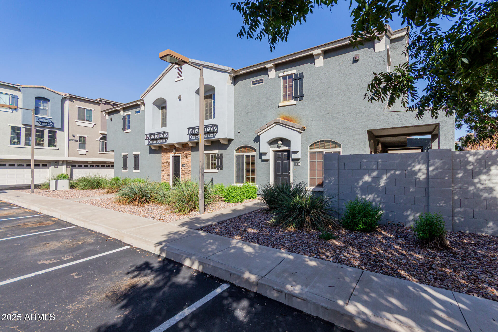 2401 East Rio Salado Parkway, Unit 1106 Tempe, AZ 85288 - Photo 3 of 40 a front view of a house with garden