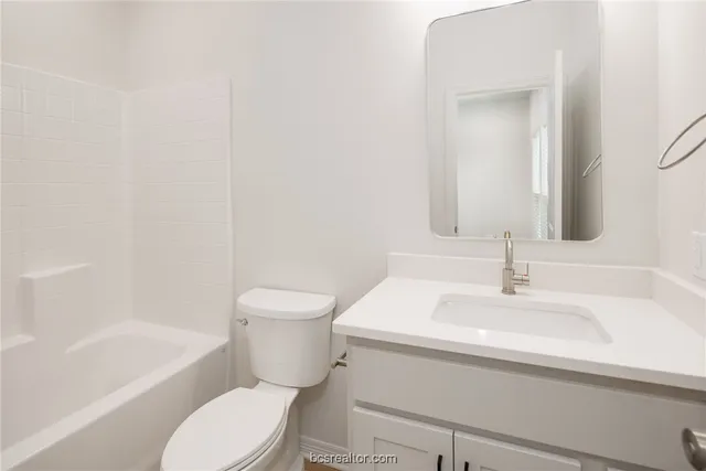 a bathroom with a sink toilet and bathtub