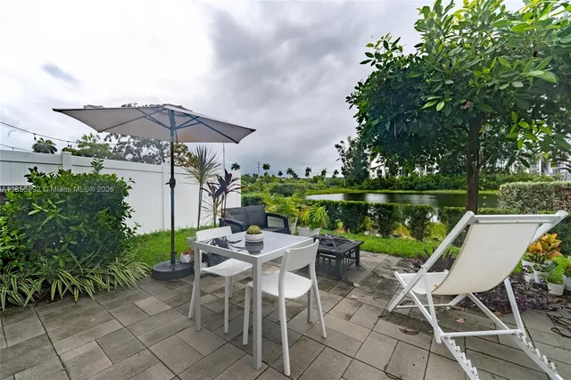 a view of a chairs and table in the patio