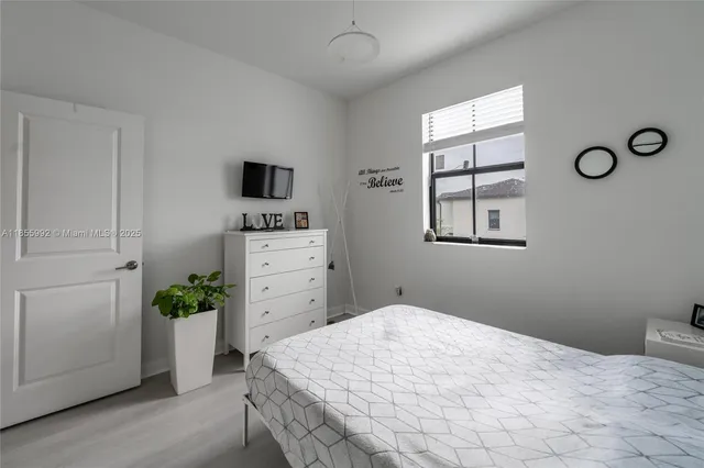 a bathroom with a sink toilet vanity and shower