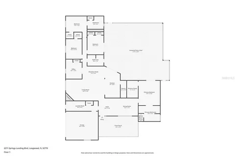a living room with lots of furniture and a large window