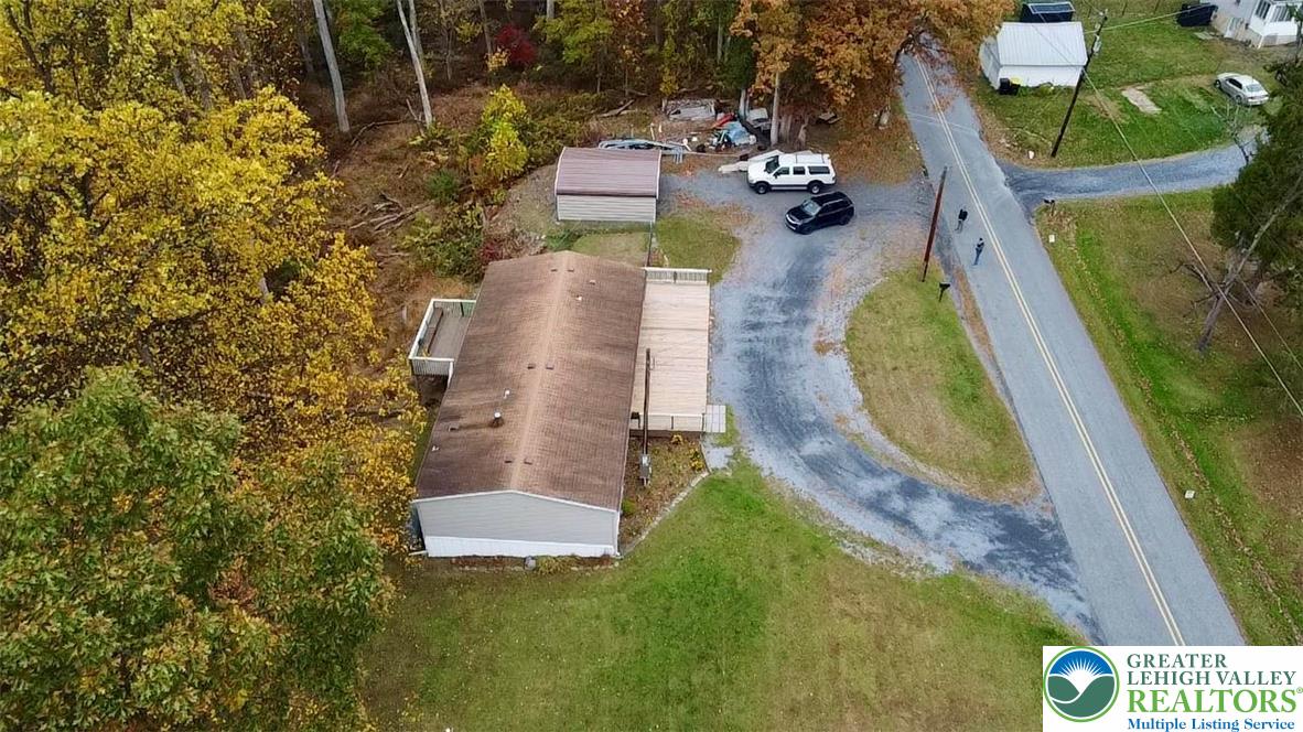 8568 Deer Road Slatington, PA 18080 - Photo 28 of 37 an aerial view of a house with swimming pool and large trees