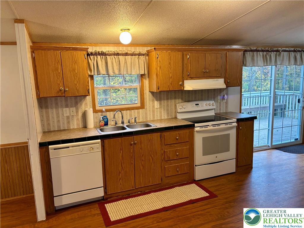 8568 Deer Road Slatington, PA 18080 - Photo 3 of 37 a kitchen with a sink window and cabinets
