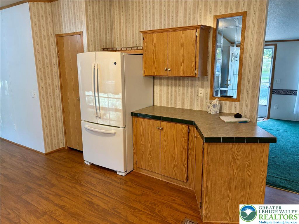 8568 Deer Road Slatington, PA 18080 - Photo 4 of 37 a kitchen with stainless steel appliances a refrigerator and a stove