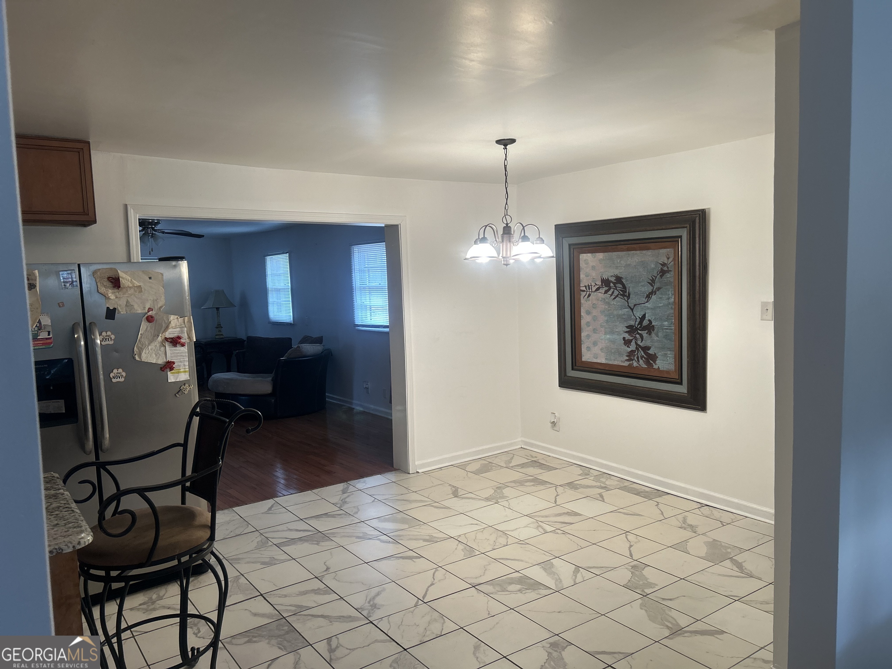 1406 Canterbury Road Griffin, GA 30223 - Photo 9 of 26 a view of a livingroom with furniture and chandelier