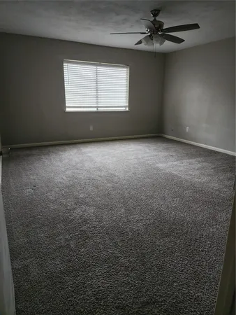 an empty room with a empty space and a window