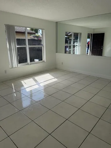 a view of empty room with windows