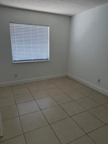 a view of a room that has a window in it