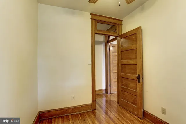 a view of front door with wooden floor