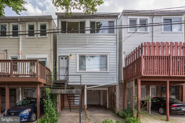 a view of a house with a entrance and stairs