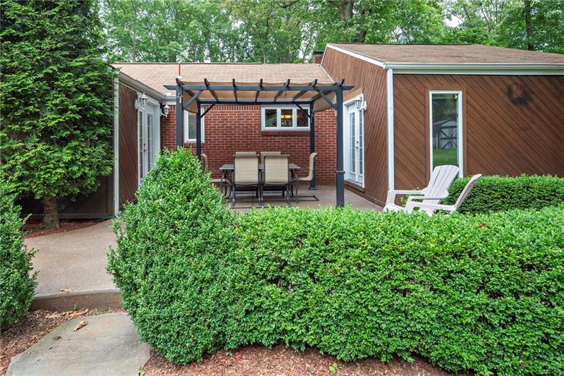 217 Oak Road Pittsburgh, PA 15239 - Photo 23 of 25 Back patio with exposed aggregate! Perfect for entertaining or relaxing!