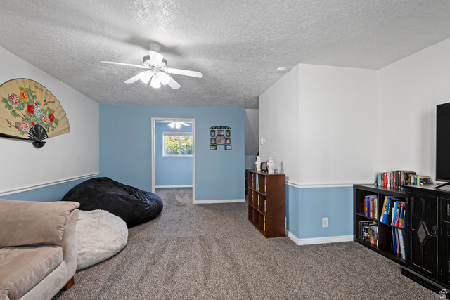 553 North 200 West Bountiful, UT 84010 - Photo 20 of 26 Living area with carpet, a textured ceiling, and ceiling fan