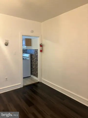 a view of a livingroom with wooden floor