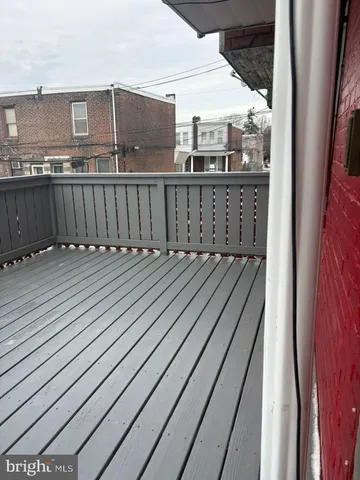 a view of balcony with wooden floor