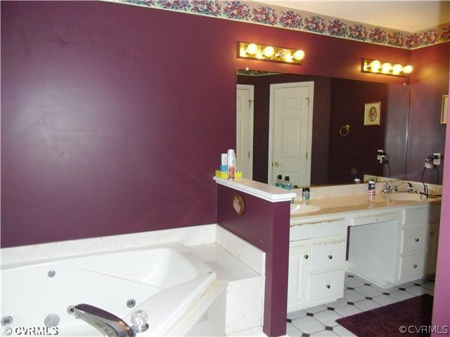 12203 River Road Chesterfield, VA 23838 - Photo 6 of 10 a bathroom with a sink and a mirror