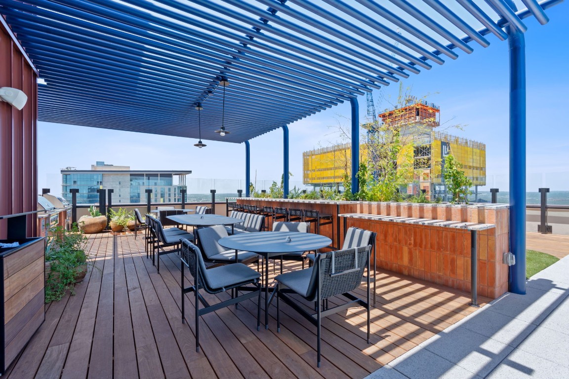 84 East Avenue, Unit 3404 Austin, TX 78701 - Photo 30 of 40 a view of a dining room with furniture window and wooden floor