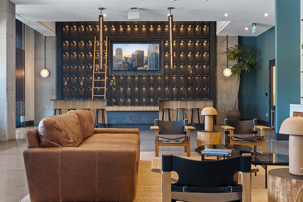 84 East Avenue, Unit 3404 Austin, TX 78701 - Photo 35 of 40 a living room with furniture a lamp and a potted plant