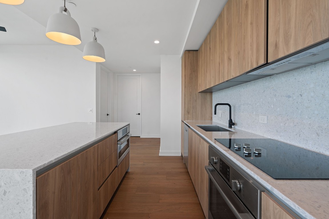 84 East Avenue, Unit 3404 Austin, TX 78701 - Photo 7 of 40 a kitchen with sink and cabinets