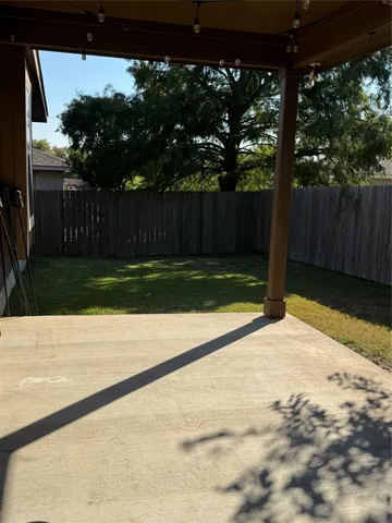 a view of house with a yard