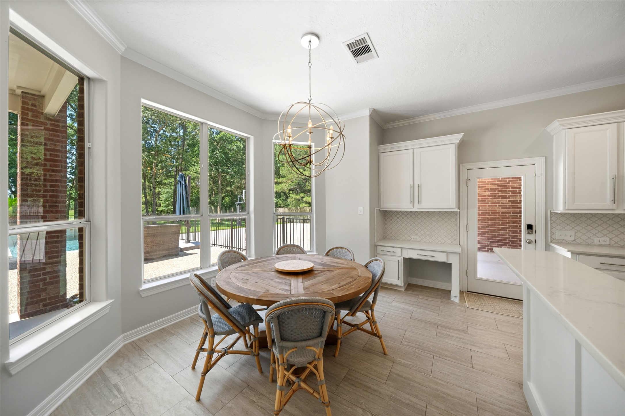 2302 Legends Shore Drive Spring, TX 77386 - Photo 15 of 48 Sunny breakfast area surrounded by windows and peaceful backyard views.