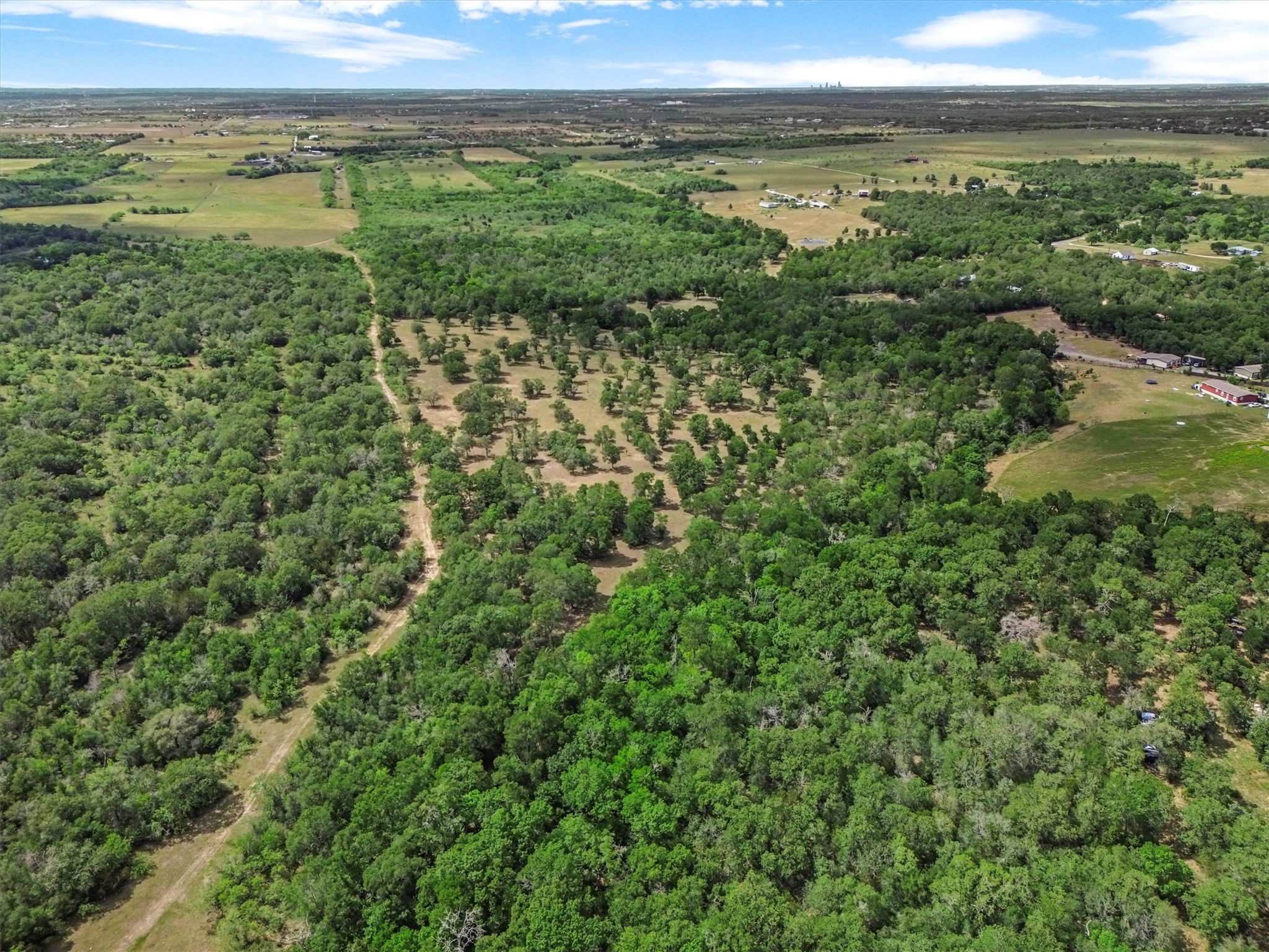 Tucked away on nearly 37 acres of peaceful Texas countryside, this one-of-a-kind property offers incredible versatility
with over $250,000 in improvements and four unique structures—making it the perfect canvas for a family compound,
creative retreat, or income-producing estate.