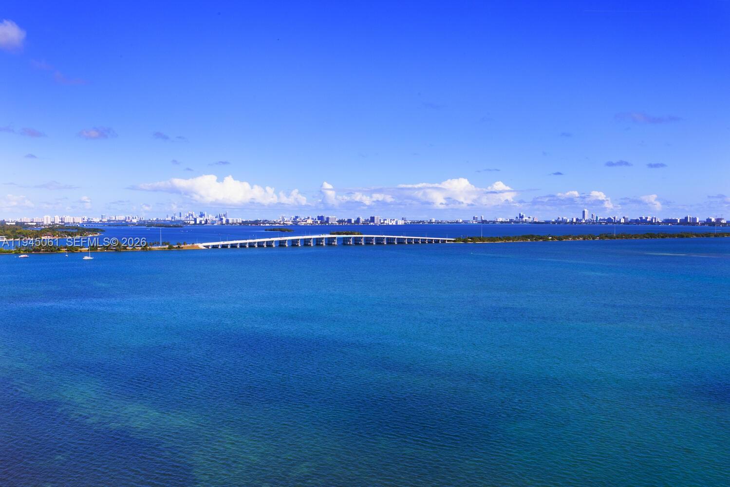 725 Northeast 22nd Street, Unit PH2B Miami, FL 33137 - Photo 2 of 21 a view of a lake and a mountain