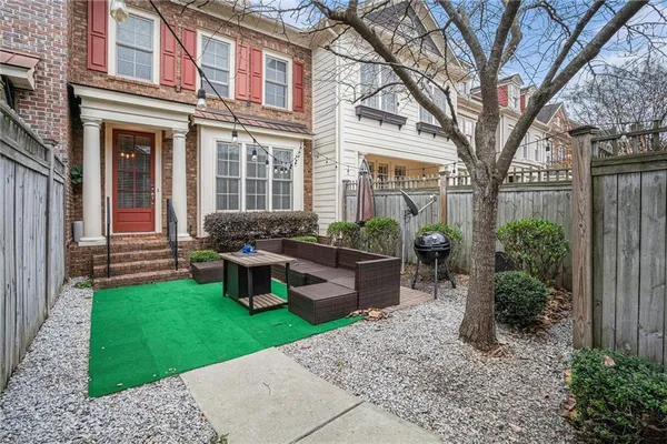 a house view with a seating space and garden