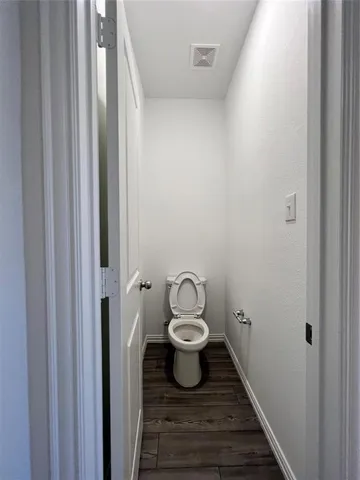 a bathroom with a toilet and a sink