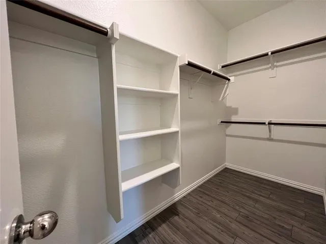 a view of an empty walk in closet
