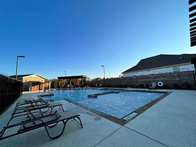 a living room with furniture a rug and a fireplace