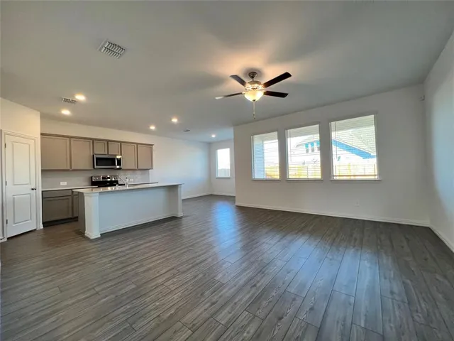 a view of kitchen with sink and wooden floor