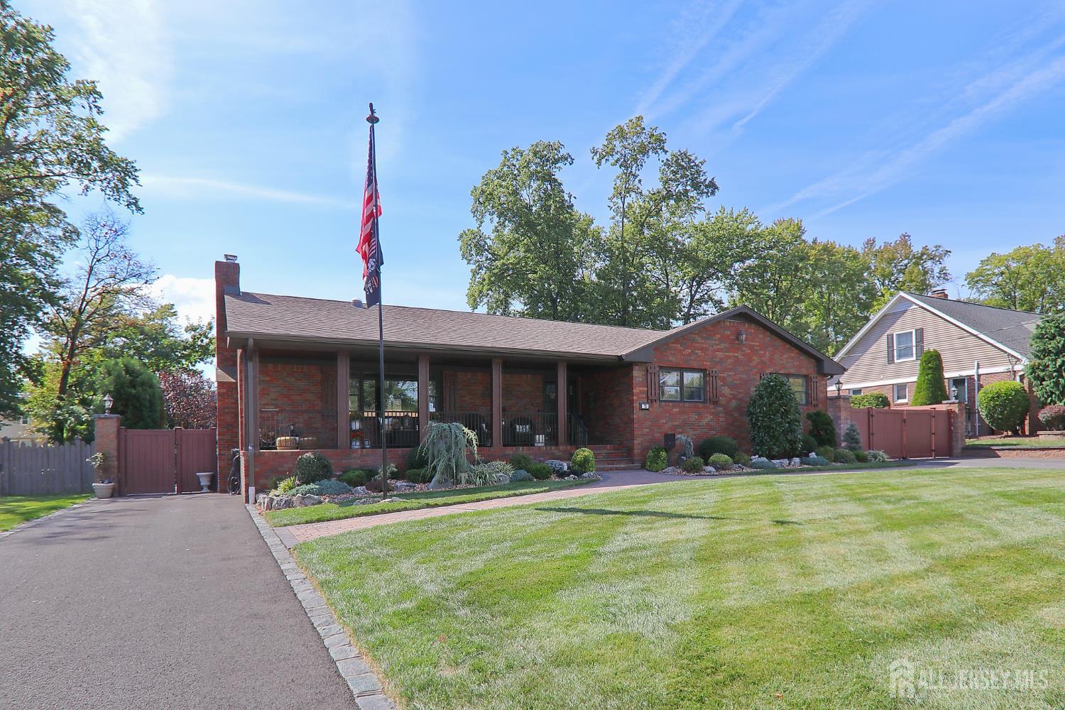 75 Highland Road Colonia, NJ 07067 - Photo 3 of 45 a front view of house with yard and green space