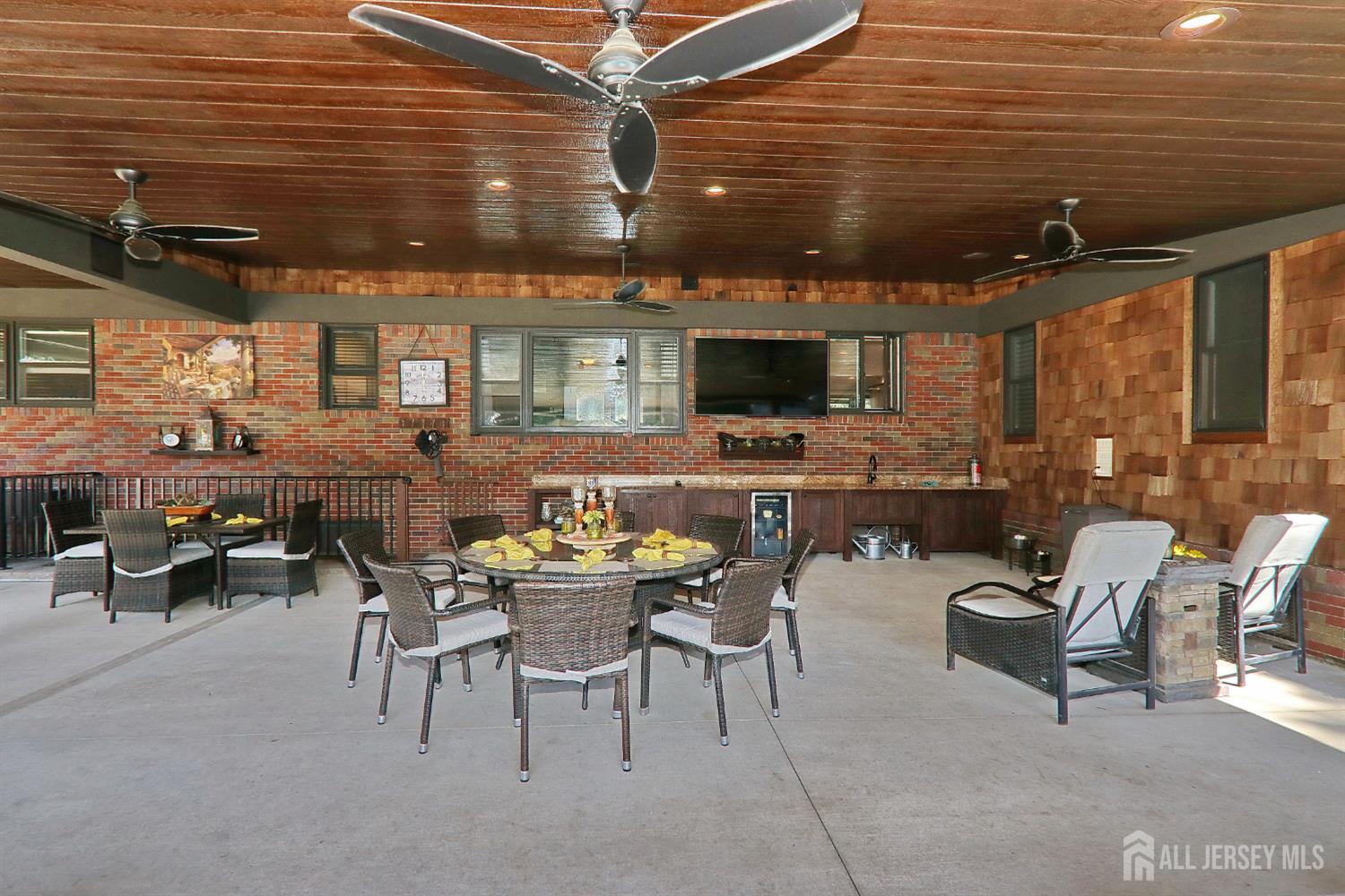 75 Highland Road Colonia, NJ 07067 - Photo 34 of 45 a outdoor space with lots of tables a chairs and a sink