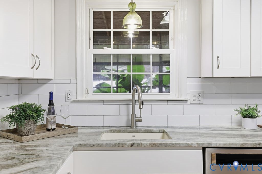 161 Arkwright Road Chesterfield, VA 23236 - Photo 14 of 43 a kitchen with granite countertop a sink and a window