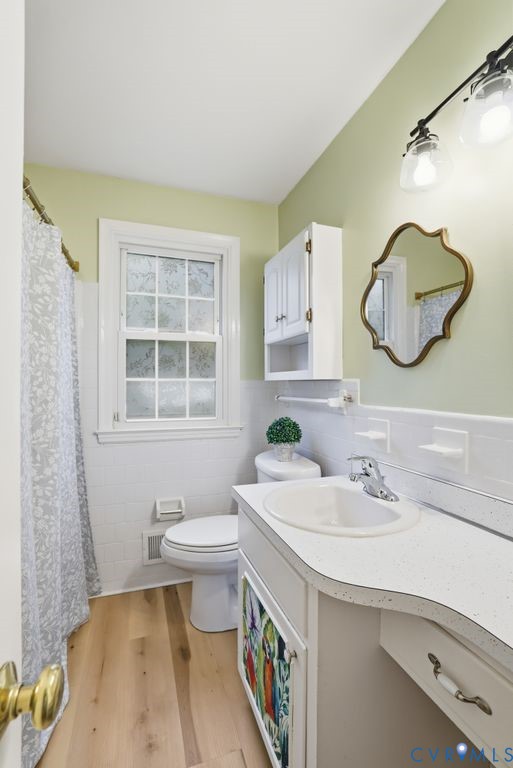 161 Arkwright Road Chesterfield, VA 23236 - Photo 24 of 43 a bathroom with a sink a toilet and a mirror