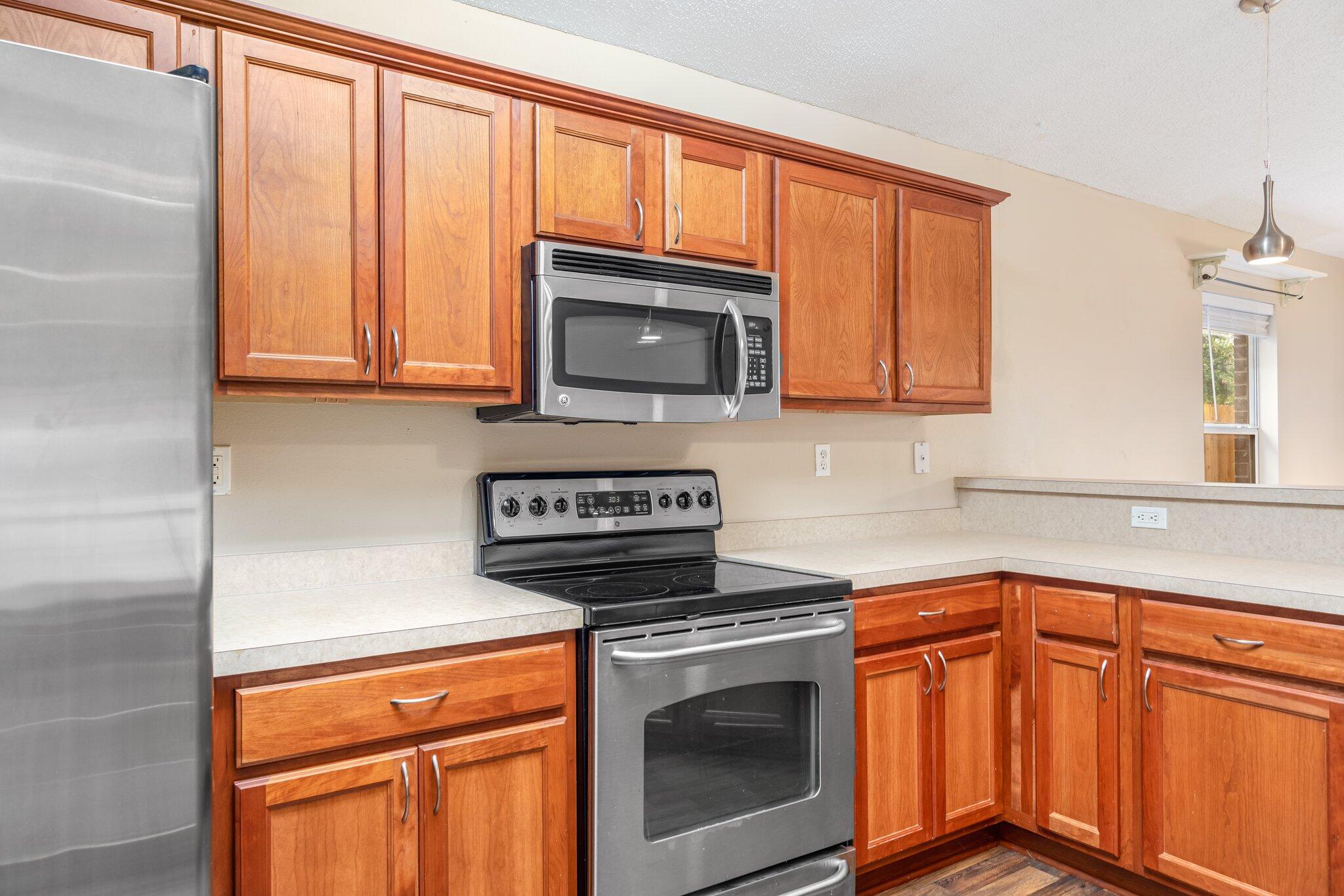 273 Limestone Circle Crestview, FL 32539 - Photo 13 of 36 a kitchen with granite countertop cabinets stainless steel appliances and a sink