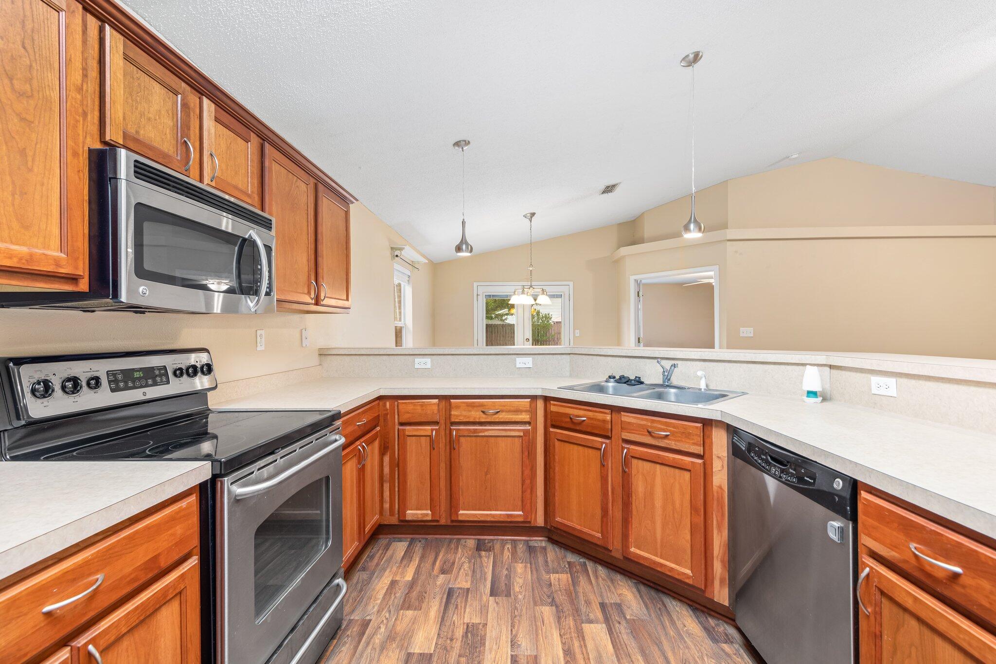 273 Limestone Circle Crestview, FL 32539 - Photo 14 of 36 a kitchen with a sink stove and microwave