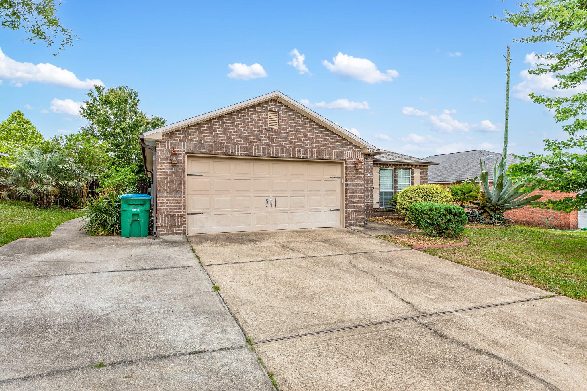 273 Limestone Circle Crestview, FL 32539 - Photo 2 of 36 a view of garage and yard