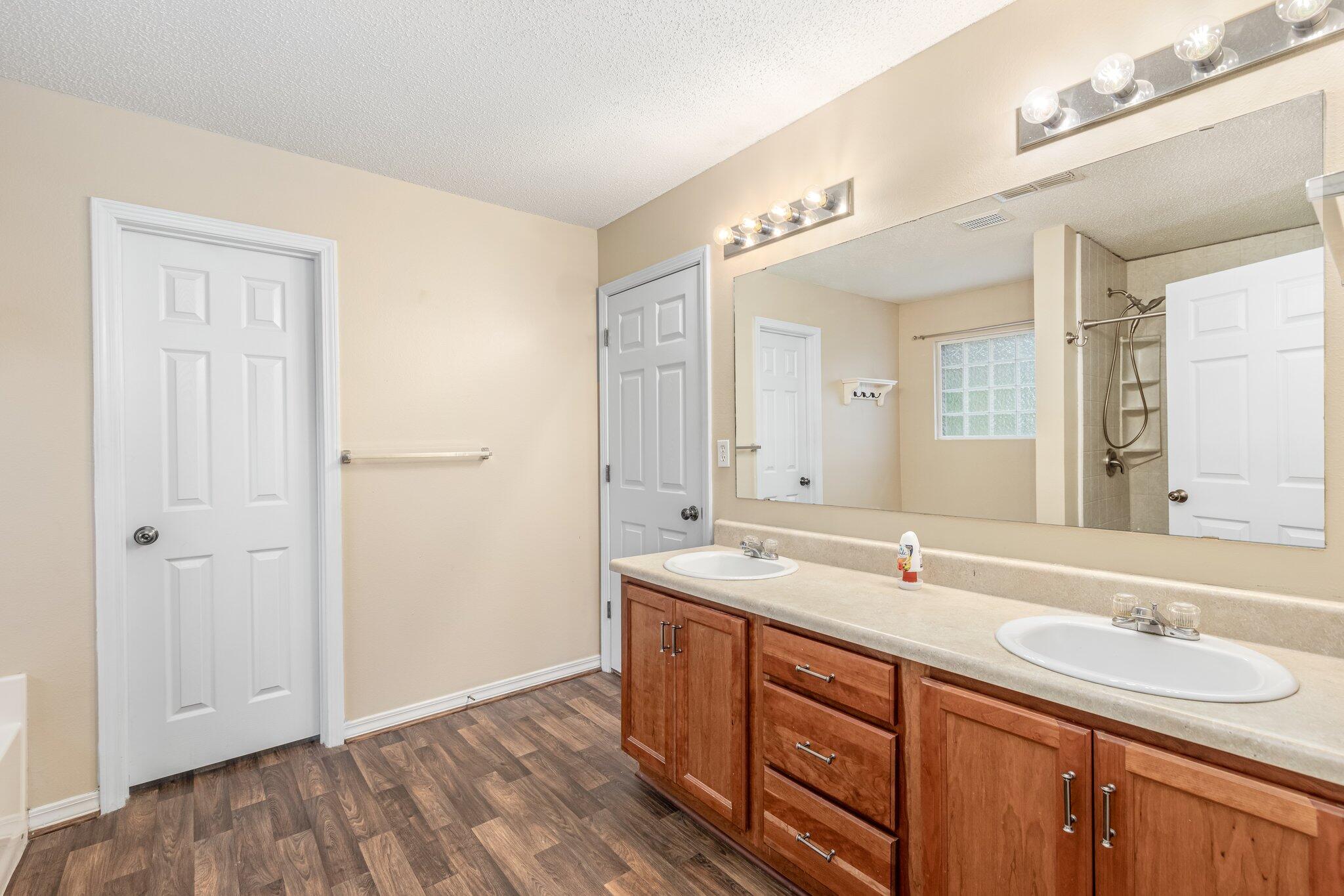 273 Limestone Circle Crestview, FL 32539 - Photo 22 of 36 a bathroom with a sink double vanity and a mirror