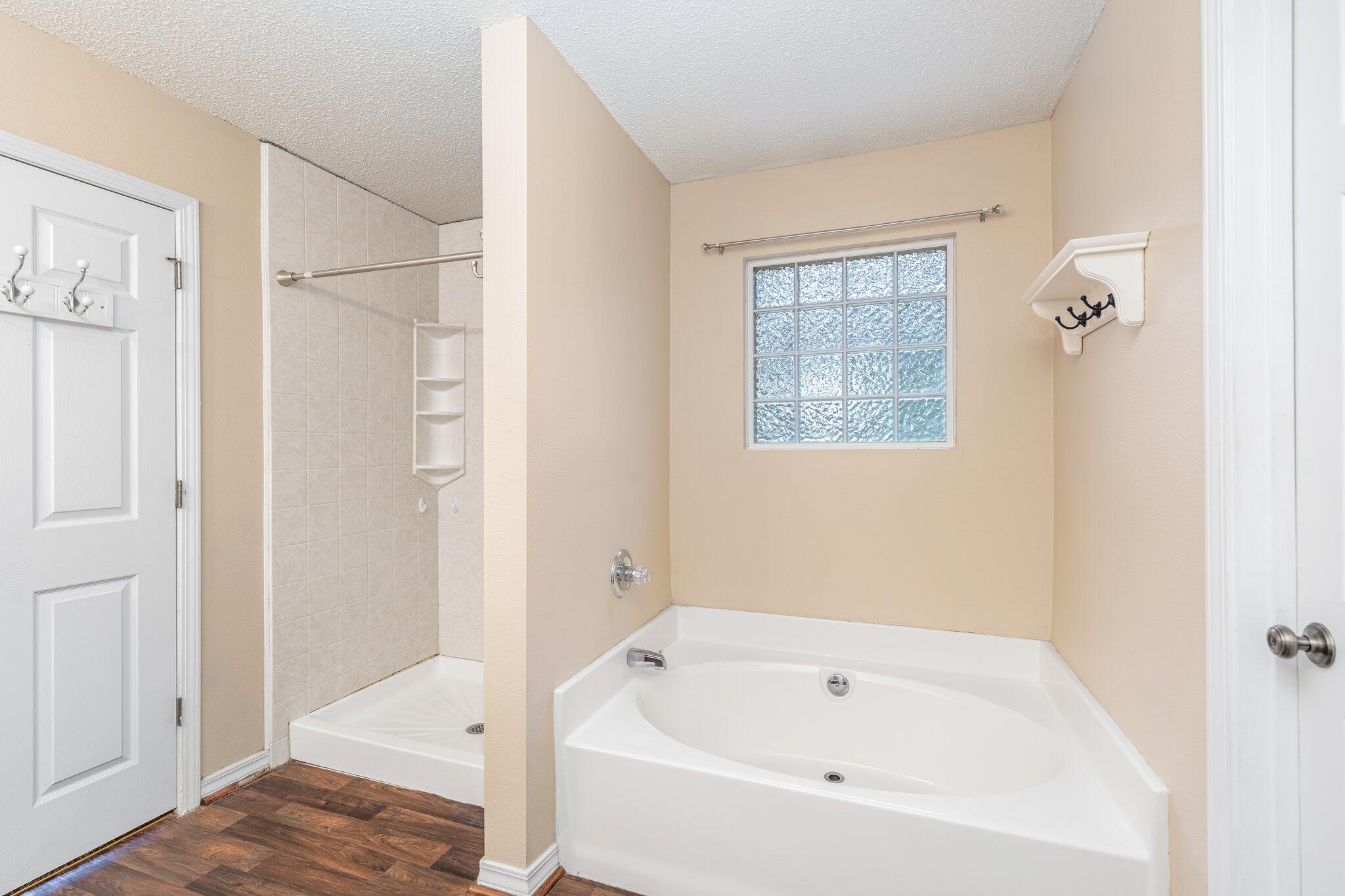 273 Limestone Circle Crestview, FL 32539 - Photo 23 of 36 a bathroom with a tub and shower