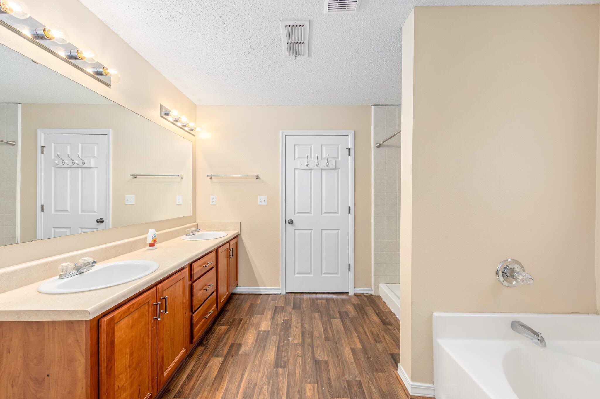 273 Limestone Circle Crestview, FL 32539 - Photo 24 of 36 a bathroom with a large tub sink and vanity