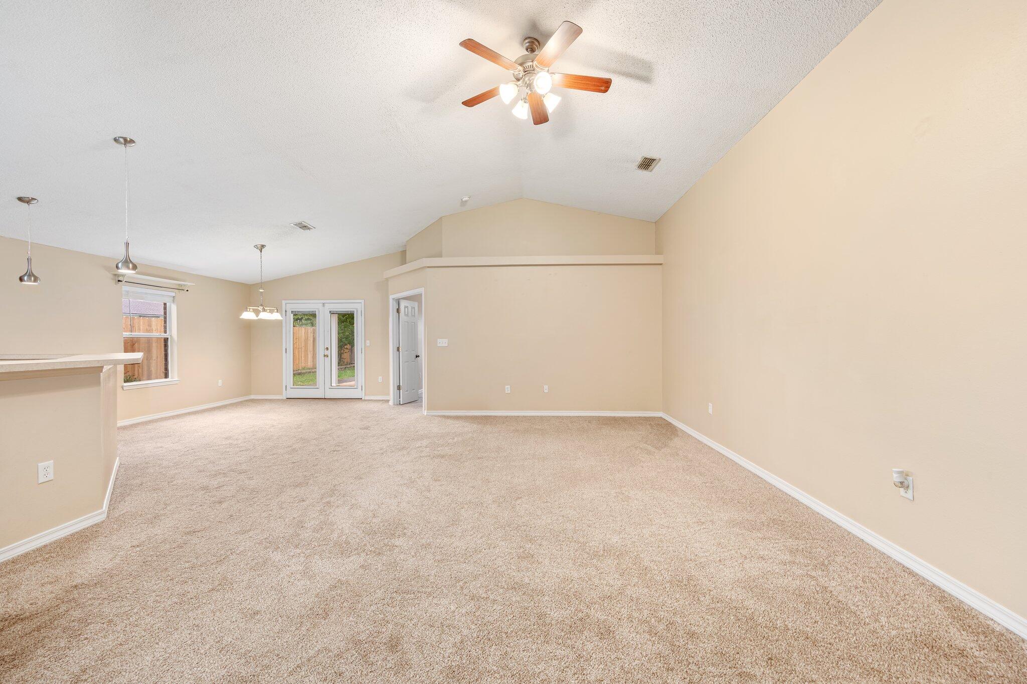 273 Limestone Circle Crestview, FL 32539 - Photo 6 of 36 a view of a livingroom with a ceiling fan and window