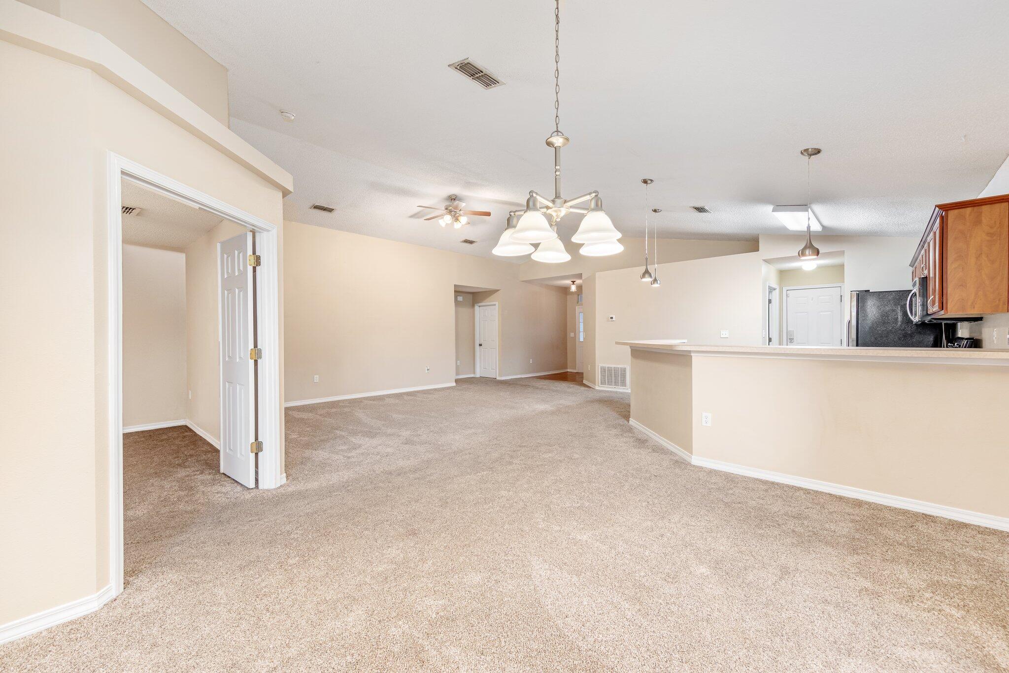 273 Limestone Circle Crestview, FL 32539 - Photo 8 of 36 a view of a kitchen with a sink and chandelier
