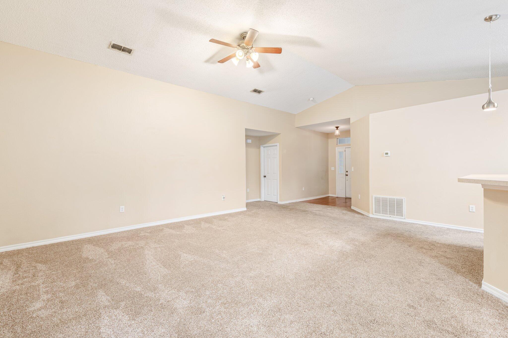 273 Limestone Circle Crestview, FL 32539 - Photo 10 of 36 an empty room with a ceiling fan and a window
